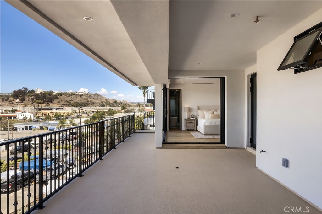 Deck of Primary: Wraparound Deck. A seamless transition from bedroom to open air. - 126 Calle Redondel, San Clemente CA 92672 - photo 41