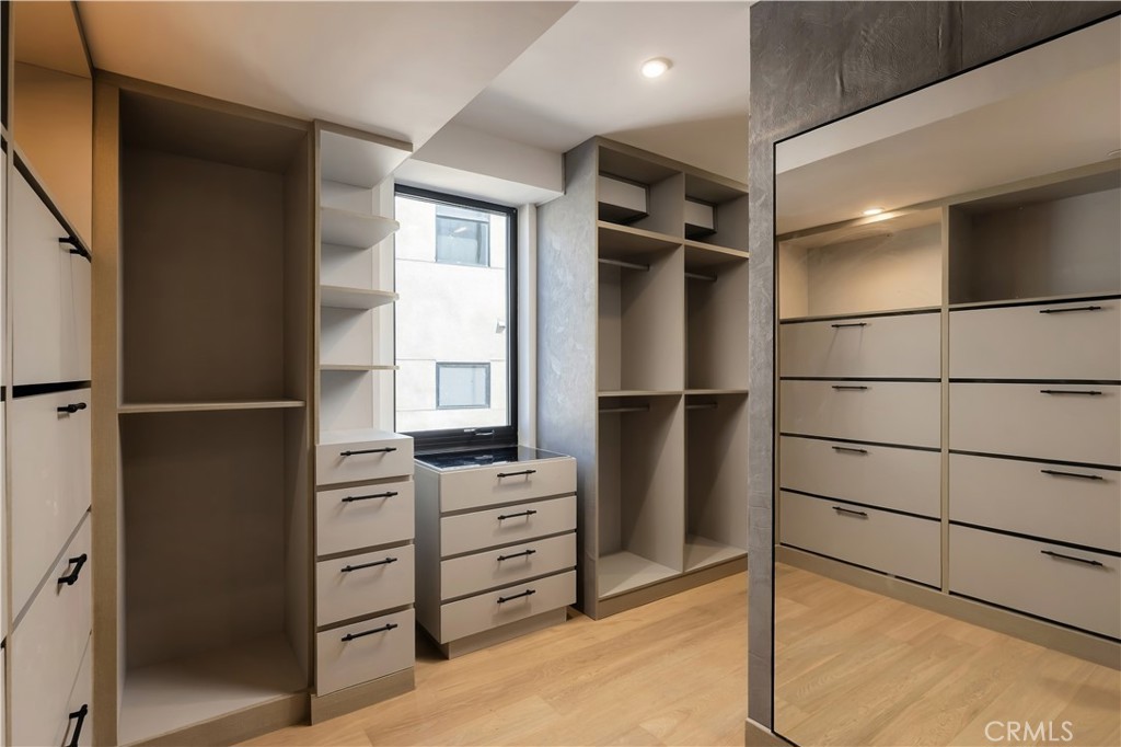 Tailored drawers, shelving, and hanging space around a full-length mirror. - 126 Calle Redondel, San Clemente CA 92672 - photo 47