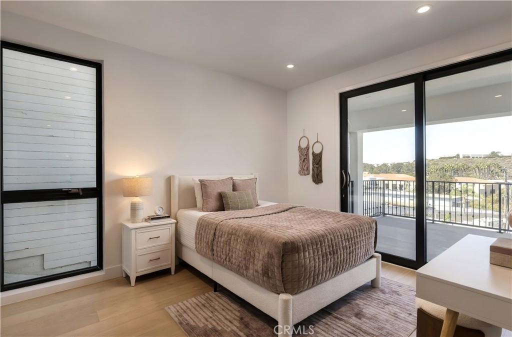 Secondary bedroom: Sliding glass opens to the covered deck and hillside views. - 126 Calle Redondel, San Clemente CA 92672 - photo 54