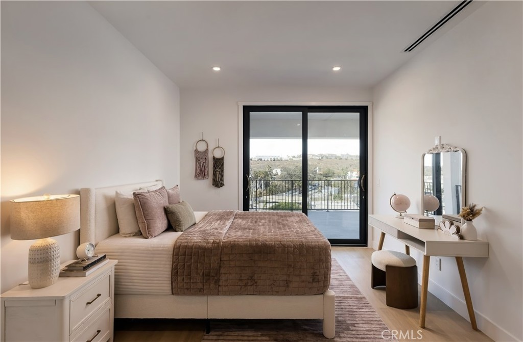 Secondary bedroom: Sliding glass opens to the covered deck and hillside views. - 126 Calle Redondel, San Clemente CA 92672 - photo 55