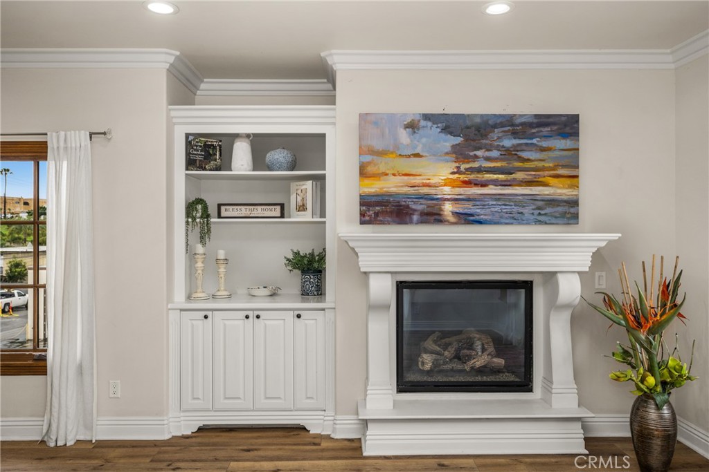 Cozy fireplace and built-in cabinetry - 1520 N El Camino Real 10, San Clemente CA 92672 - photo 8