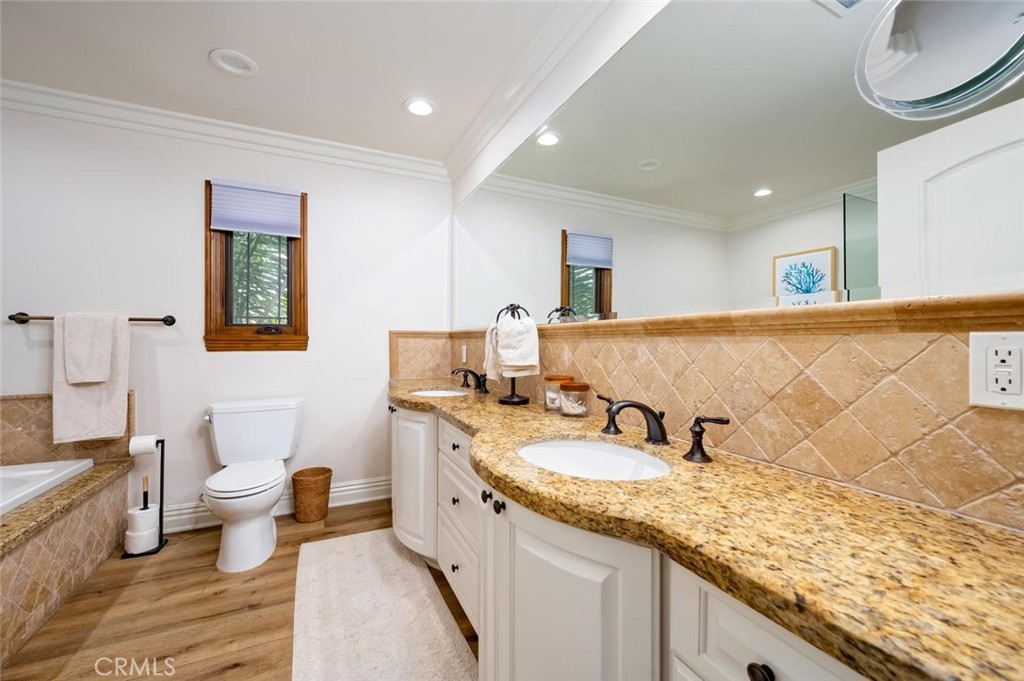 Luxurious primary Bathroom with, dual sinks, jacuzzi tub and separate shower - 1520 N El Camino Real 26, San Clemente CA 92672 - photo 26