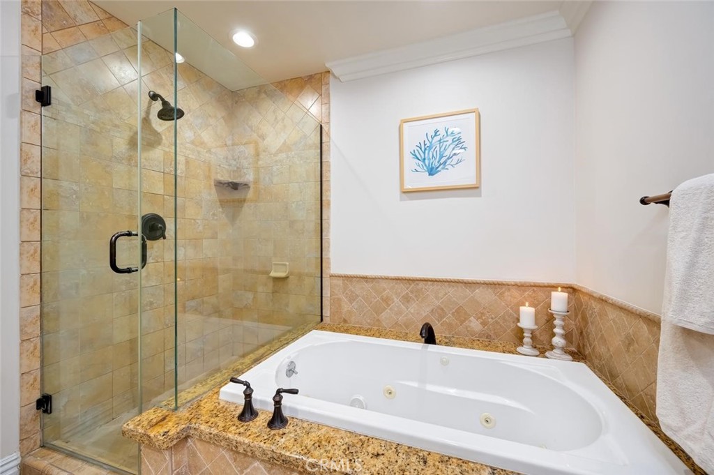 Luxurious primary Bathroom with, dual sinks, jacuzzi tub and separate shower - 1520 N El Camino Real 26, San Clemente CA 92672 - photo 27