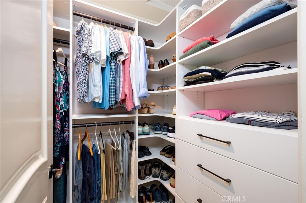 Primary bedroom's walk in closet - 1520 N El Camino Real 26, San Clemente CA 92672 - photo 28
