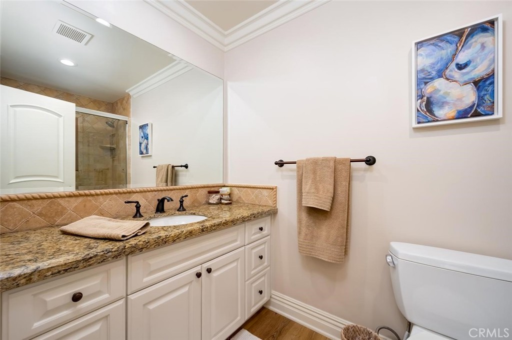 En Suite bedroom's full bathroom with granite countertops - 1520 N El Camino Real 26, San Clemente CA 92672 - photo 30