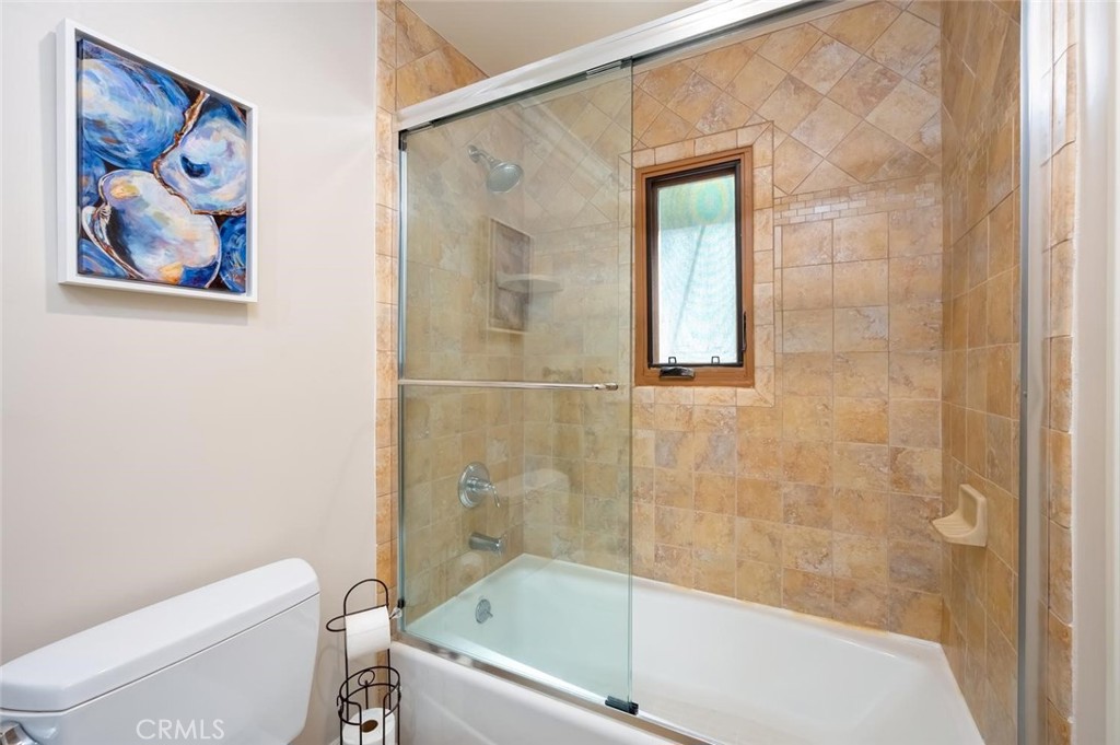 En Suite bedroom's full bathroom with granite countertops - 1520 N El Camino Real 26, San Clemente CA 92672 - photo 31