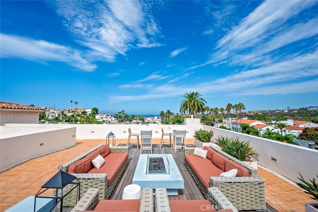 Ocean view Rooftop deck with BBQ area, fire pit and lots of cozy seating....great for entertaining! - 1520 N El Camino Real 26, San Clemente CA 92672 - photo 36