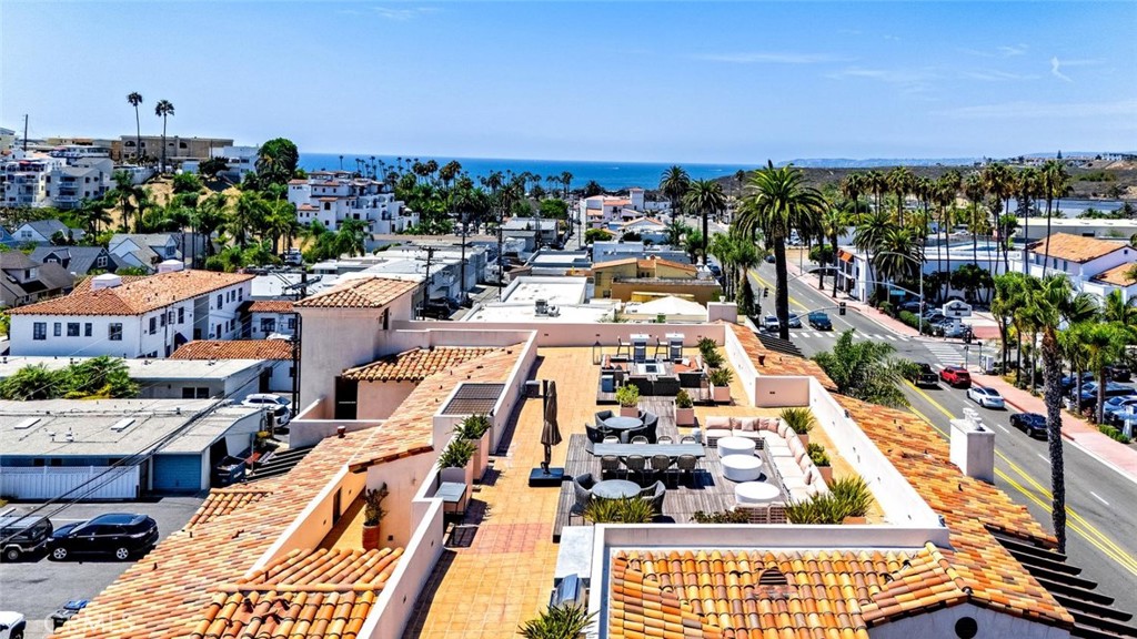 Ocean view Rooftop deck with BBQ area, fire pit and lots of cozy seating....great for entertaining! - 1520 N El Camino Real 26, San Clemente CA 92672 - photo 37