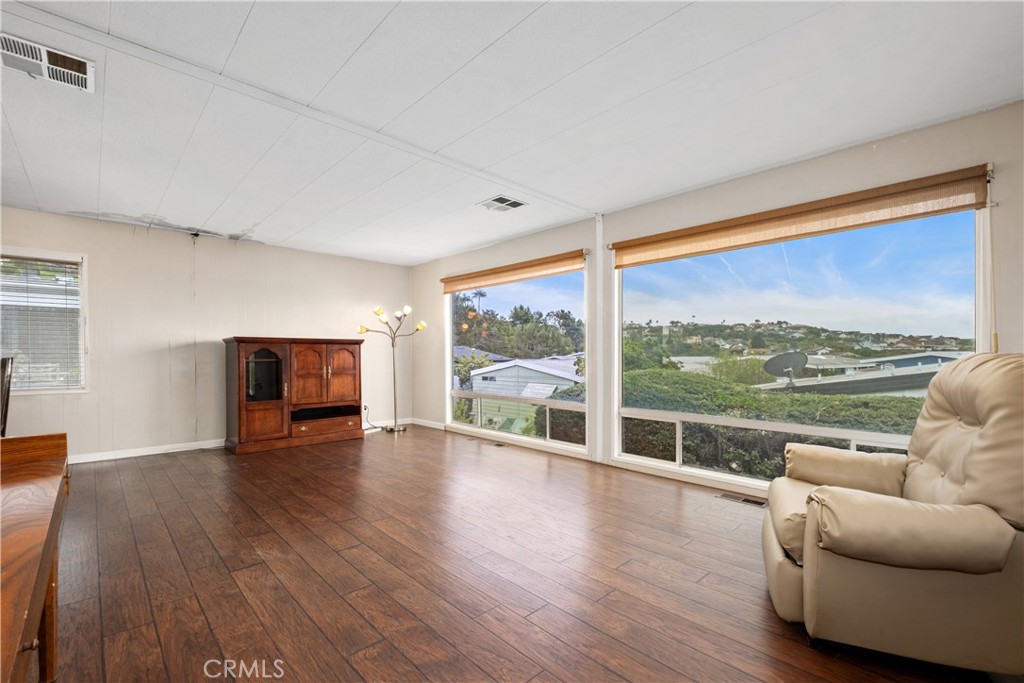 living room with big view windows - 173 Mira Del Oeste, San Clemente CA 92673 - photo 1