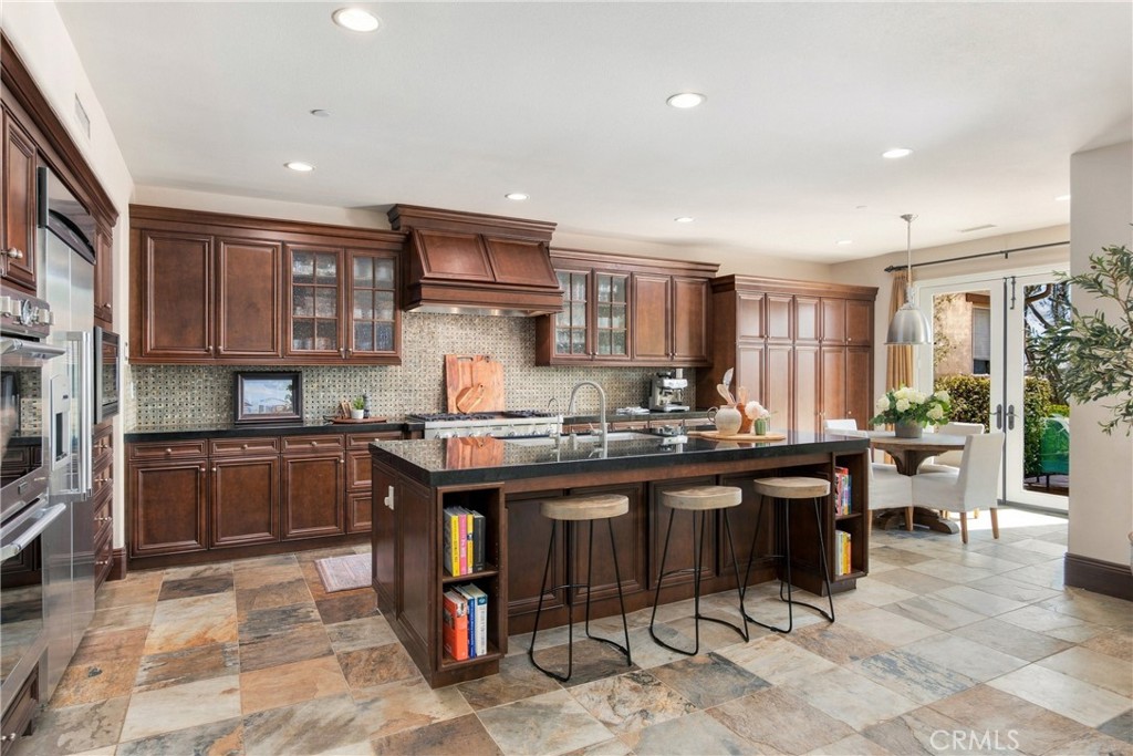 Large center island in kitchen serves as breakfast counter - 18 Via Alcamo, San Clemente CA 92673 - photo 4