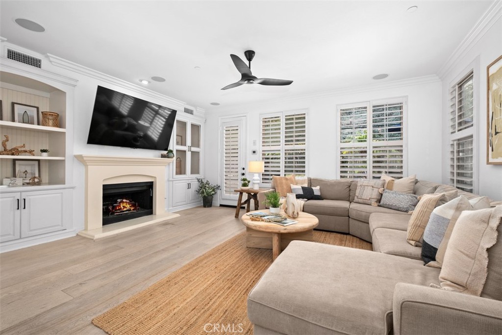 Large family room with fireplace and access to the backyard. - 19 Calle Verdadero, San Clemente CA 92673 - photo 5