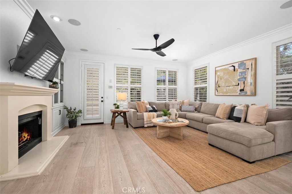 Family room features ceiling fan, surround sound, fireplace, and access to the backyard. - 19 Calle Verdadero, San Clemente CA 92673 - photo 20