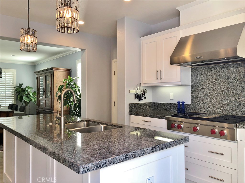 gorgeous grey granite counters, center kitchen island with sink, magnetic knife holder - 216 Via Murcia, San Clemente CA 92672 - photo 1