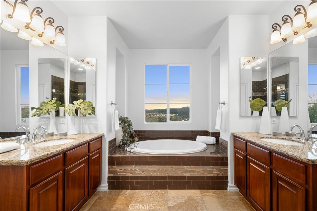 Dual vanities w/ storage, extra large soaking tub & window enhance the primary bathroom - 23 Via Cristobal, San Clemente CA 92673 - photo 25