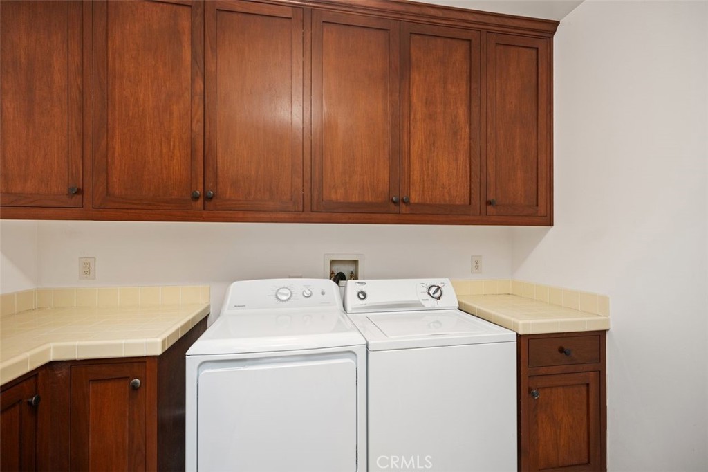 Laundry room with washer and dryer. - 240 Avenida Rosa B, San Clemente CA 92672 - photo 26