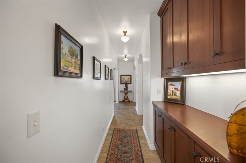 Hallway from bedroom and bathroom towards kitchen and living area. - 240 Avenida Rosa B, San Clemente CA 92672 - photo 27