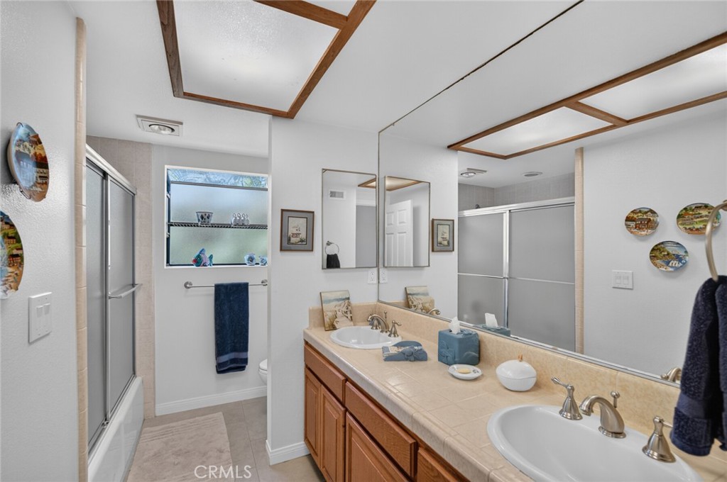 Hallway bathroom with dual sinks - 2403 Calle Monte Carlo, San Clemente CA 92672 - photo 33