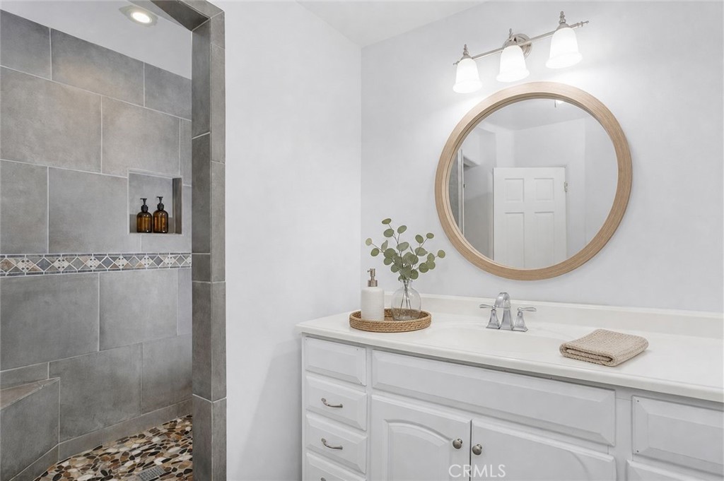 Main unit restroom has been upgraded with beautiful walk-in stone shower. - 251 Avenida Del Mar, San Clemente CA 92672 - photo 4