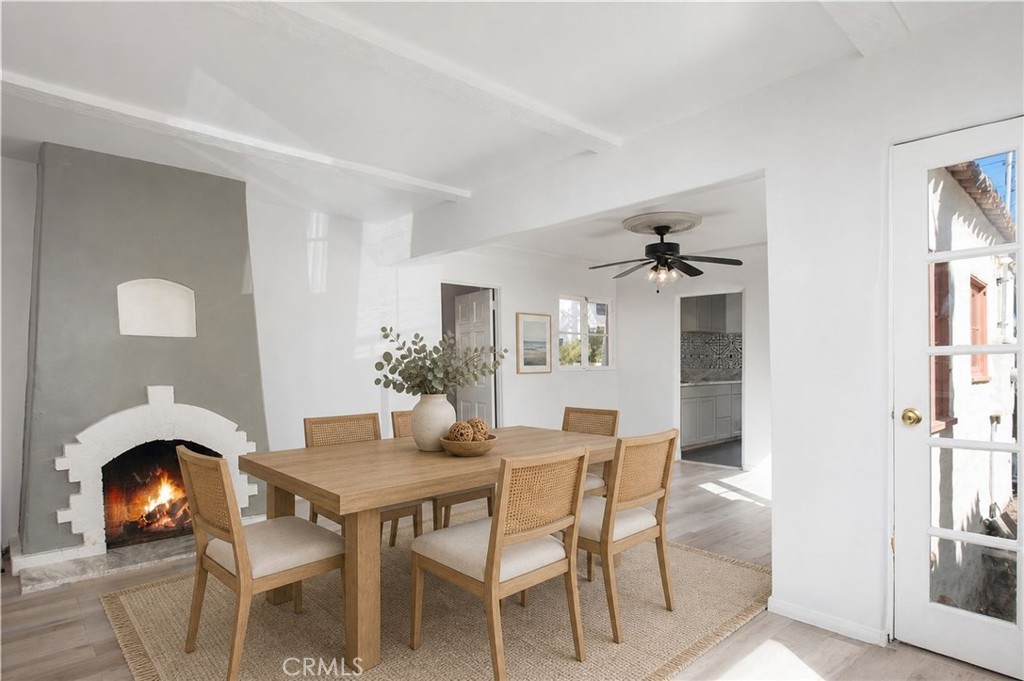 The dining room is very large and features a cozy fireplace. - 251 Avenida Del Mar, San Clemente CA 92672 - photo 5