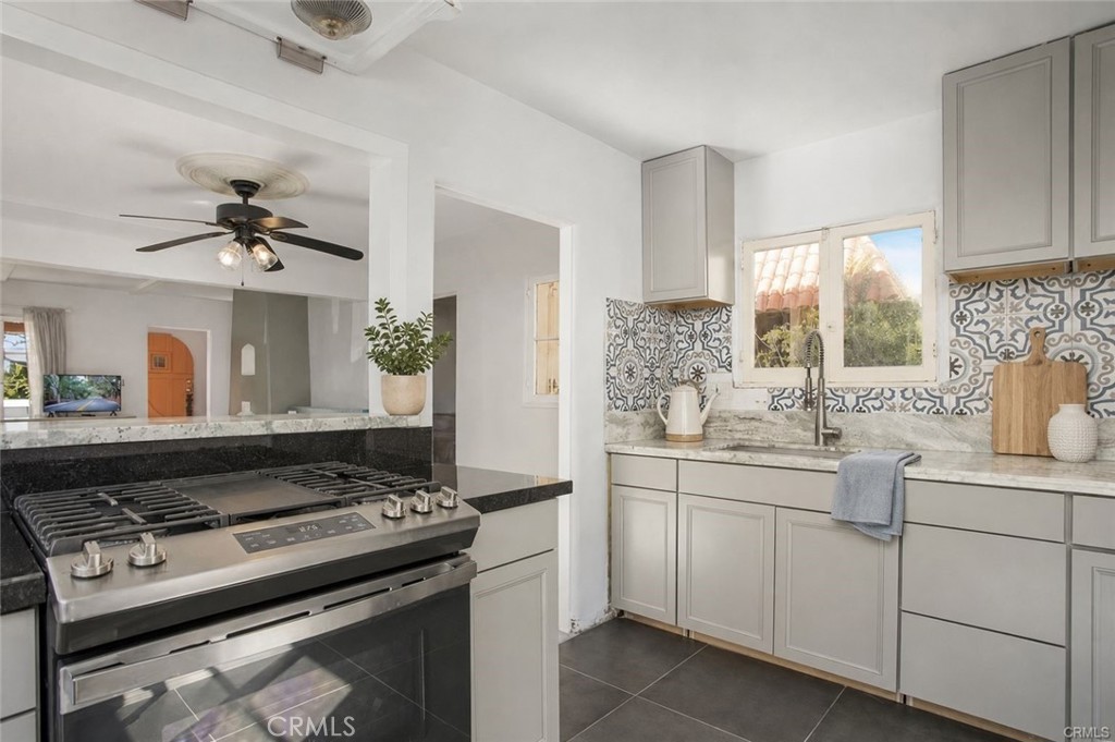 The kitchen has been recently upgraded with beautiful backsplash, stone counters, and pot & pan drawers. - 251 Avenida Del Mar, San Clemente CA 92672 - photo 6