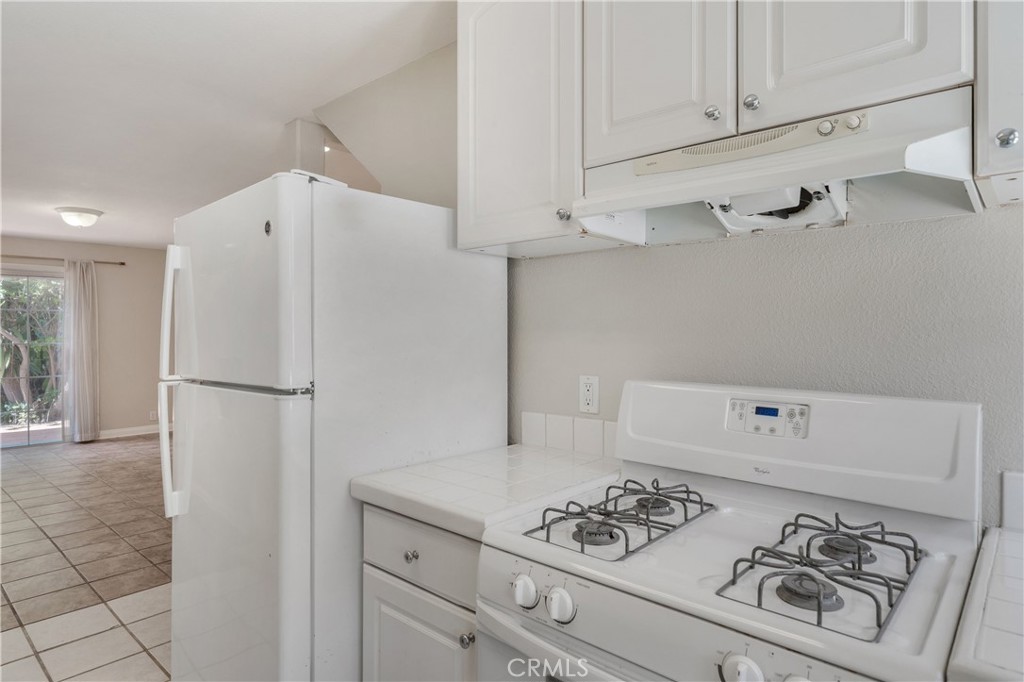 Sparkling white kitchen downstairs - 2707 S El Camino Real, San Clemente CA 92672 - photo 11