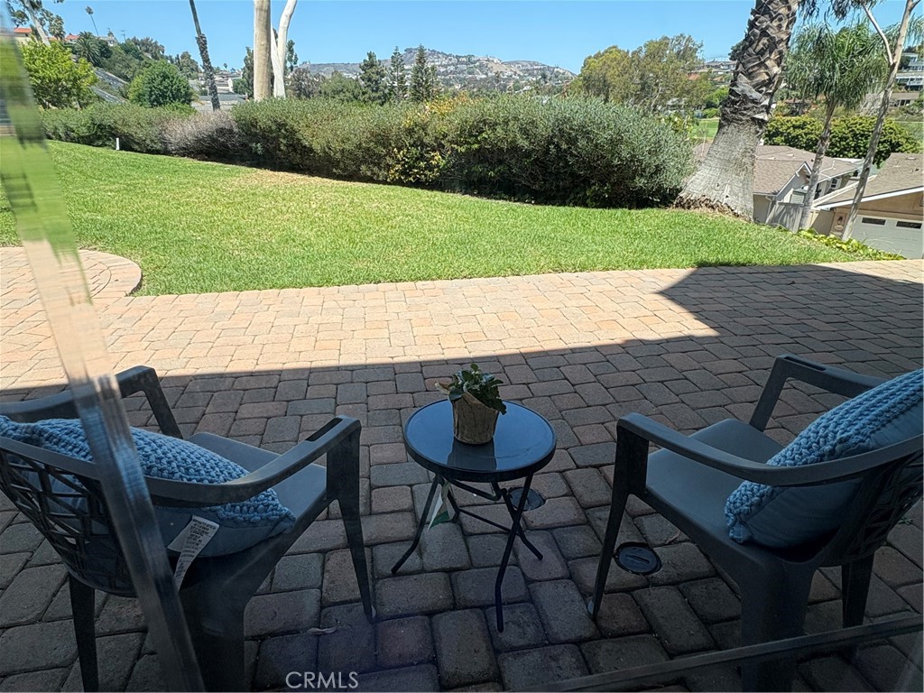 Your own yard without the hassles of maintenance and with a view of golf course/hillside. - 2802 Camino Capistrano C, San Clemente CA 92672 - photo 1