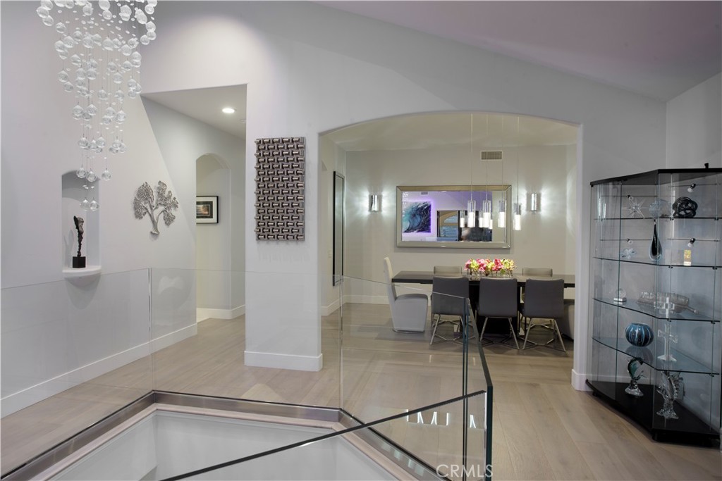 The foyer flows effortlessly into the formal dining room, where soaring ceilings, a sculptural crystal chandelier, and c - 3 Via Pasa, San Clemente CA 92673 - photo 4