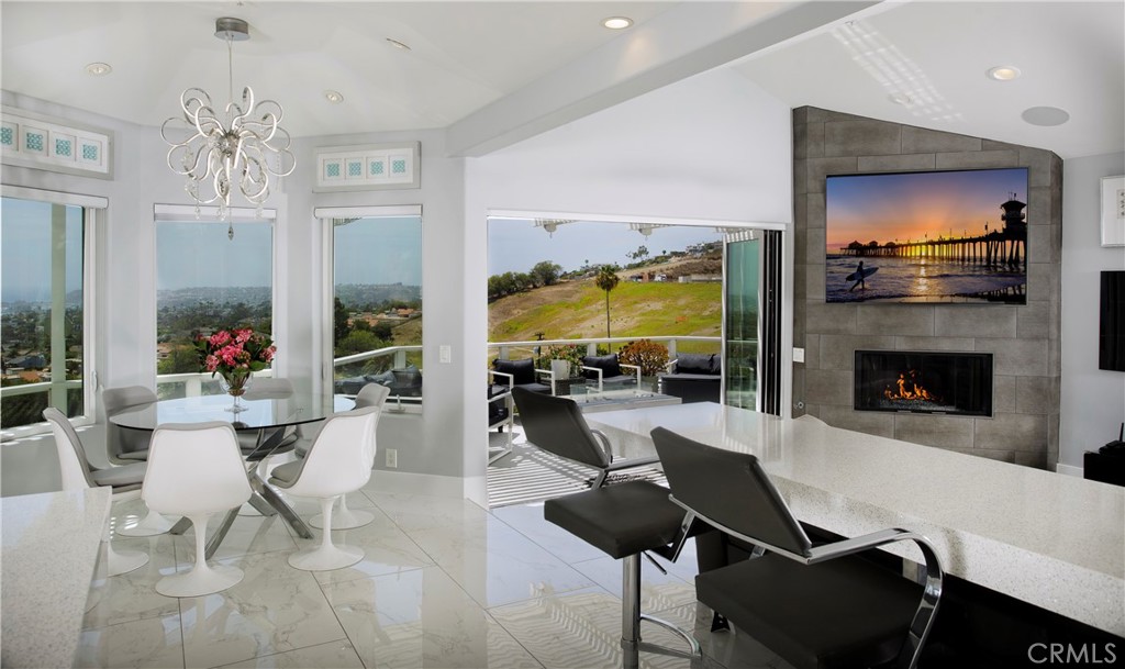 The open-concept great room seamlessly unites the chef's kitchen, breakfast area, and ocean-view living space, with expa - 3 Via Pasa, San Clemente CA 92673 - photo 10