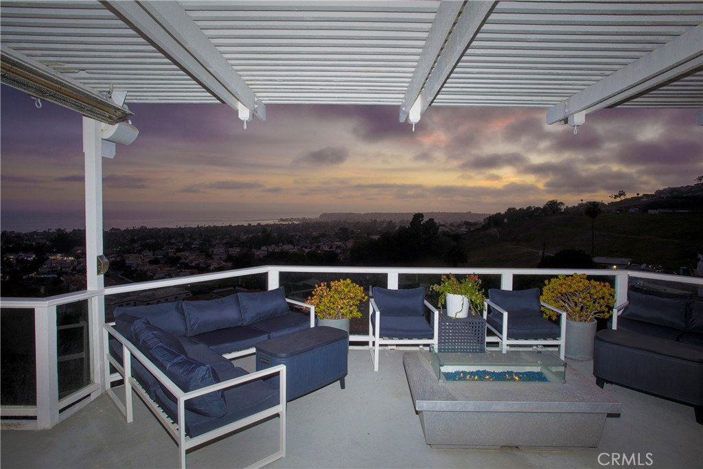 Expansive ocean-view terrace extends the home's living space outdoors, offering multiple seating areas, a contemporary f - 3 Via Pasa, San Clemente CA 92673 - photo 14