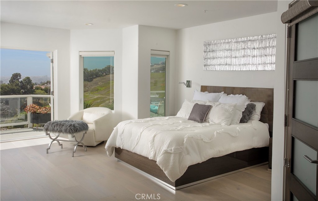 The tranquil primary suite opens to a private ocean-view terrace, creating a peaceful retreat filled with natural light - 3 Via Pasa, San Clemente CA 92673 - photo 17