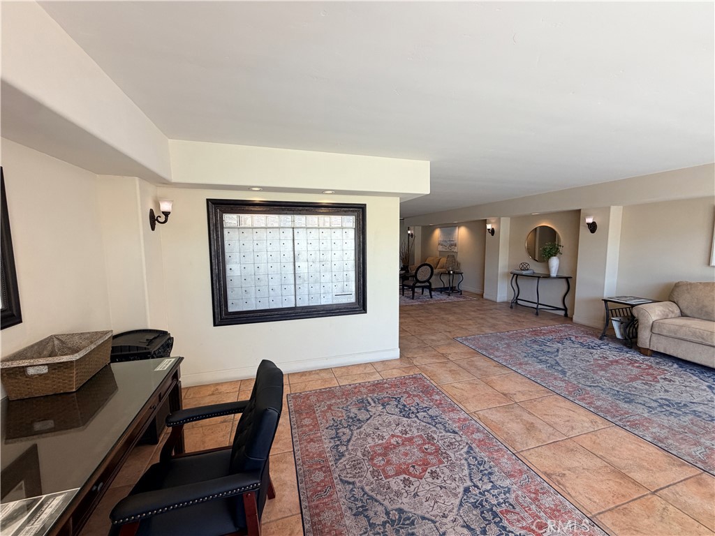 Community lobby, sitting area, mailboxes and deliveries. - 405 Avenida Granada 404, San Clemente CA 92672 - photo 15
