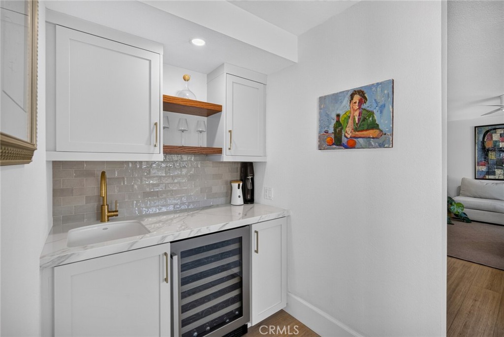 Dry bar with floating shelves, wine fridge and entertaining storage - 409 Arenoso 2, San Clemente CA 92672 - photo 23
