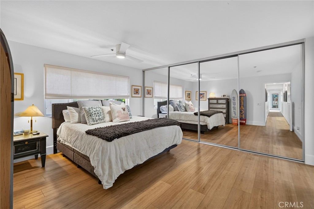 Primary bedroom suite with mirrored closets - 409 Arenoso 2, San Clemente CA 92672 - photo 27
