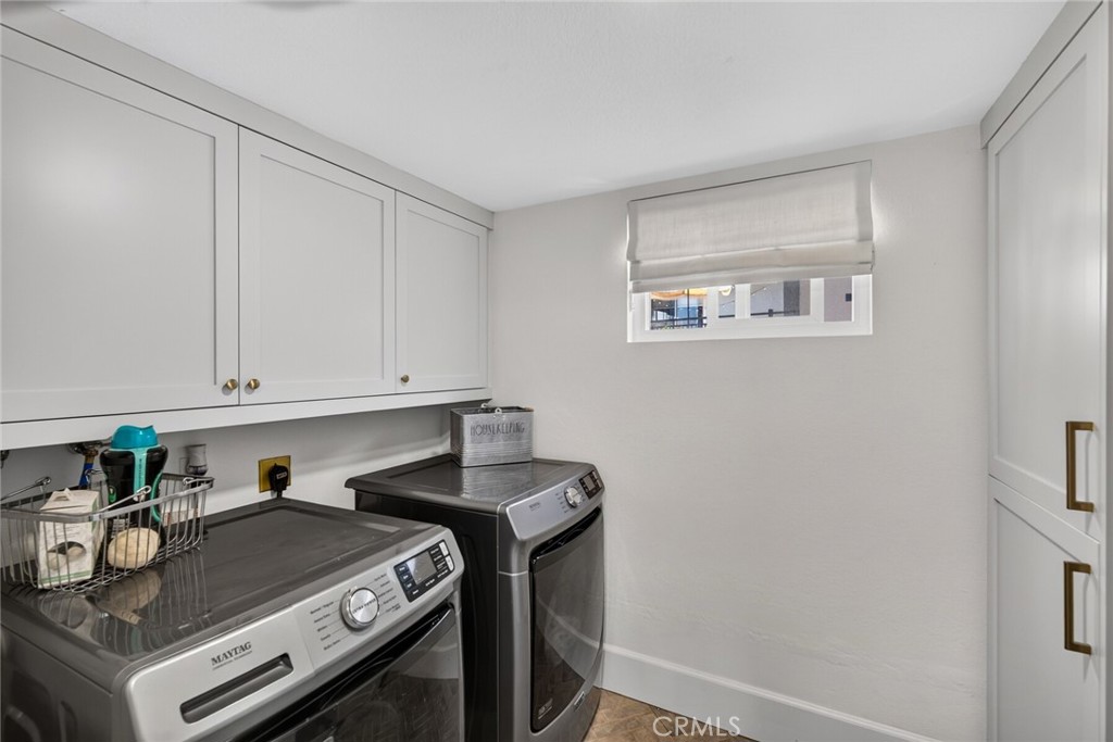 Laundry room in the unit with lots of extra space - 409 Arenoso 2, San Clemente CA 92672 - photo 40