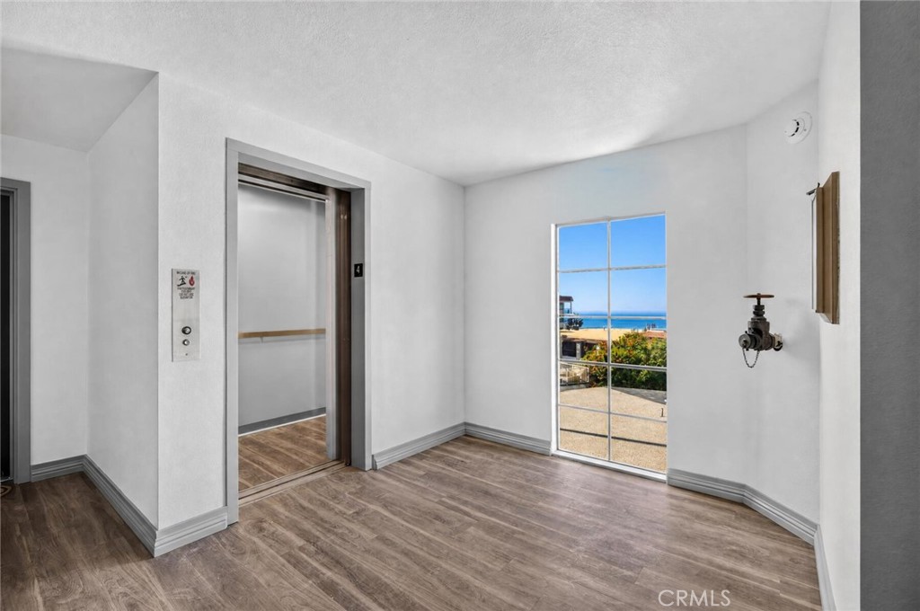 Four floors of condos that all have a door to a lobby with direct access to the new elevator. Hallways have been newly u - 409 Arenoso 2, San Clemente CA 92672 - photo 44