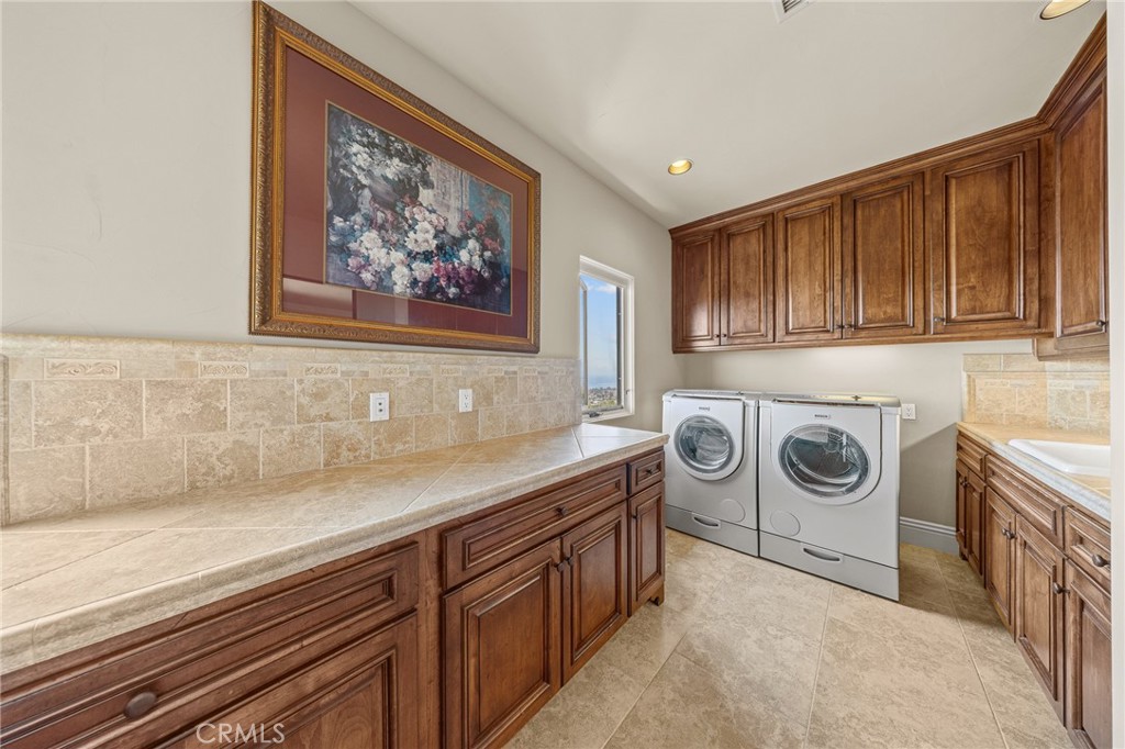 Spacious Upstairs Laundry Room with Custom Cabinetry & Counter Space - 41 Marbella, San Clemente CA 92673 - photo 42