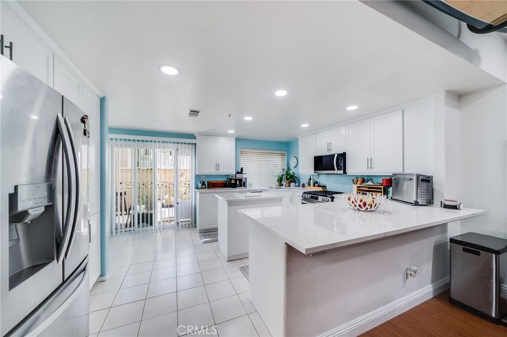 Remodeled kitchen with quartz counters, new cabinets, new appliances - 423 Via Presa, San Clemente CA 92672 - photo 6