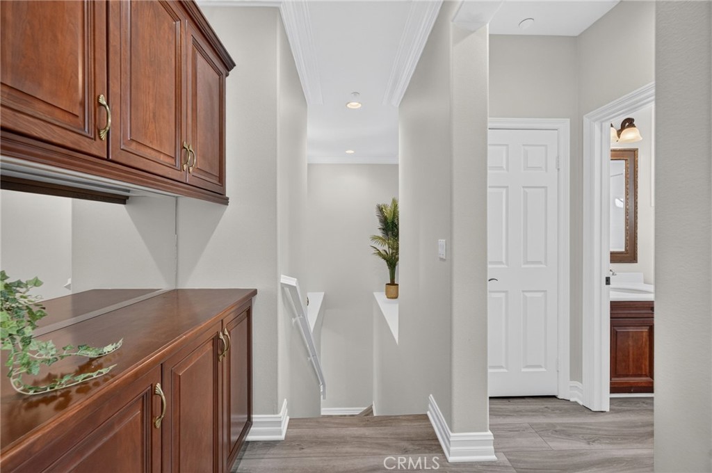 Top landing looking down the staircase. Linen cupboard & additional closet - 50 Paseo Verde, San Clemente CA 92673 - photo 35