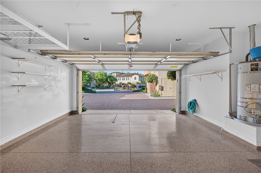 2 Car Garage, Epoxy Floors, Additional Storage Racks above opened garage door - 50 Paseo Verde, San Clemente CA 92673 - photo 47