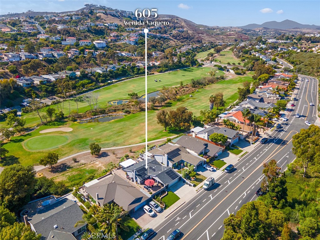 Overlooking the 9th fairway of Shorecliffs Golf Club with panoramic golf course and hillside views. - 605 Avenida Vaquero, San Clemente CA 92673 - photo 1
