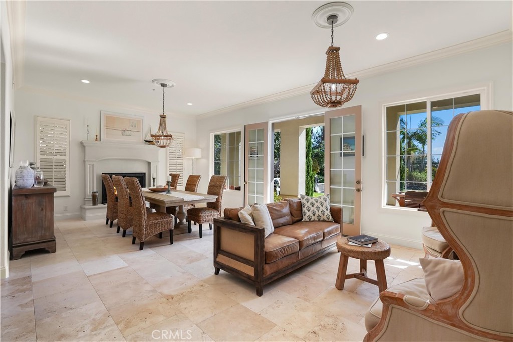 Formal living and dining room with French doors and cozy fireplace. - 6614 Colina Puesta, San Clemente CA 92673 - photo 9