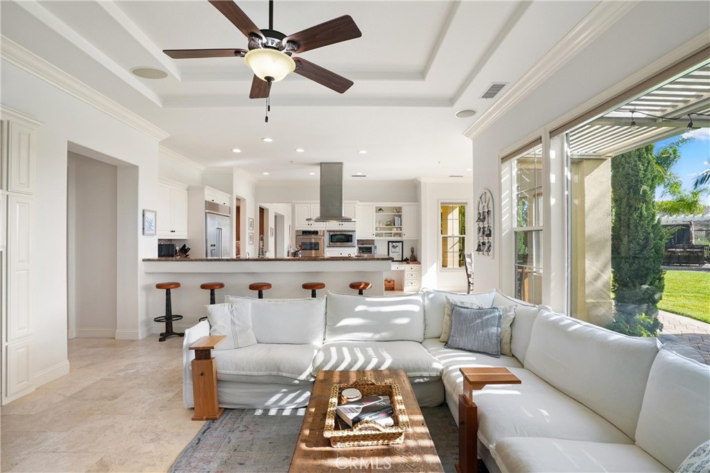 Inviting family room featuring a cozy fireplace, built in cabinetry, and abundant natural light. - 6614 Colina Puesta, San Clemente CA 92673 - photo 17