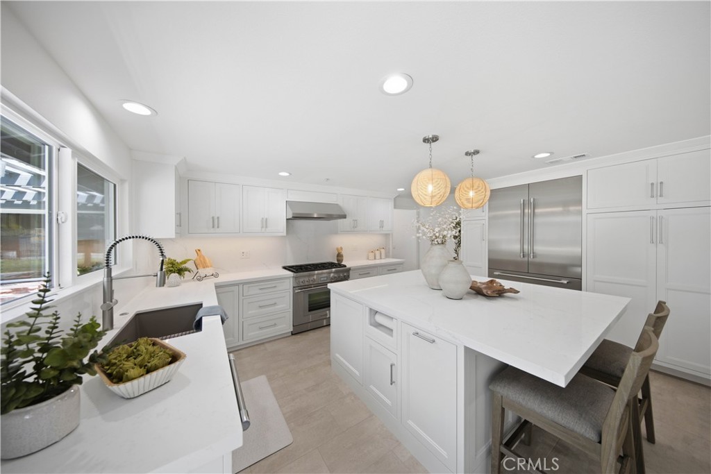 Remodeled Kitchen with Center Island and Stainless Steel Thermador Appliances. - 880 Avenida Acapulco, San Clemente CA 92672 - photo 14