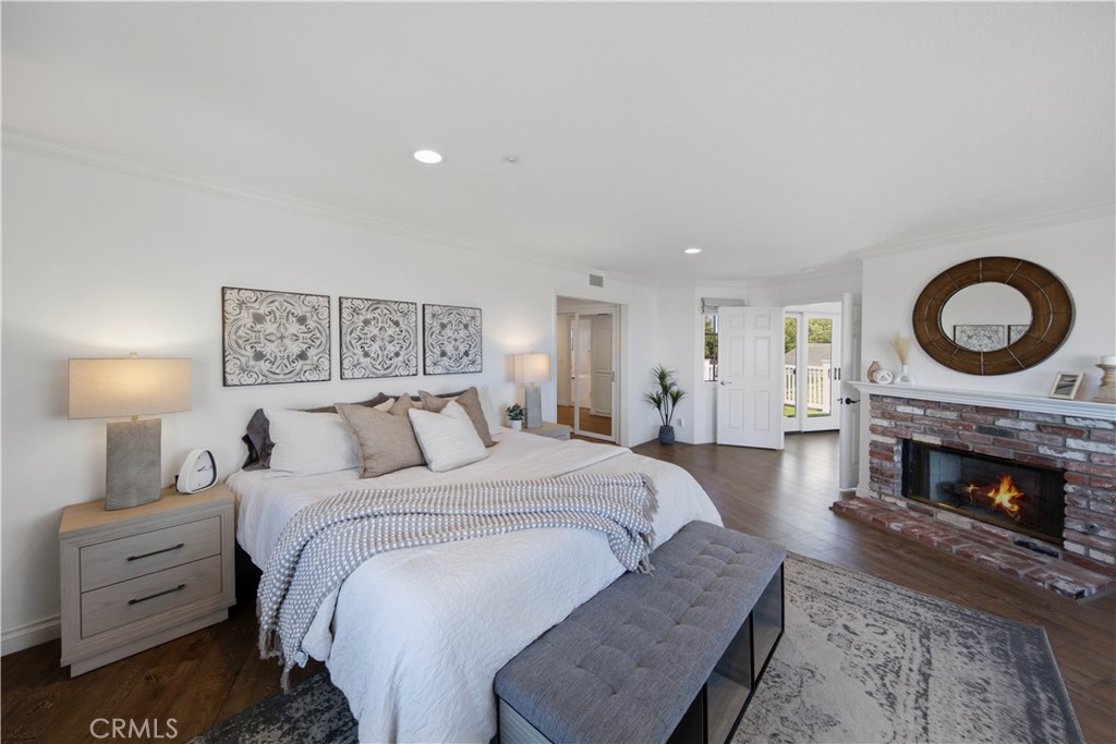 Primary Bedroom with Fireplace and Magnificent Ocean Views. - 880 Avenida Acapulco, San Clemente CA 92672 - photo 20