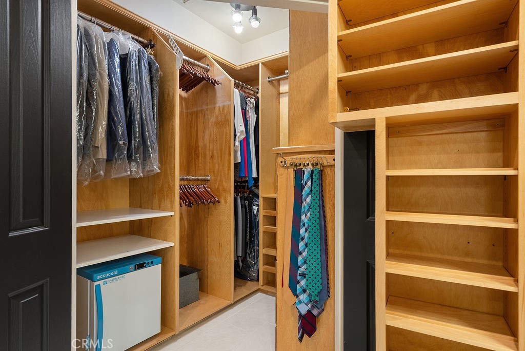 Walk-in closet with built-ins. - 22 Plaza Caloroso, San Juan Capistrano CA 92675 - photo 27