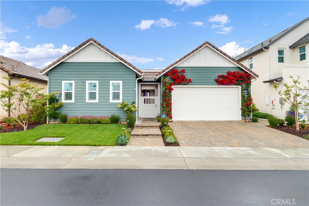 A striking modern farmhouse exterior with timeless curb appeal, featuring board-and-batten detailing, manicured landscap - 26253 Wagon Drive, San Juan Capistrano CA 92675 - photo 1