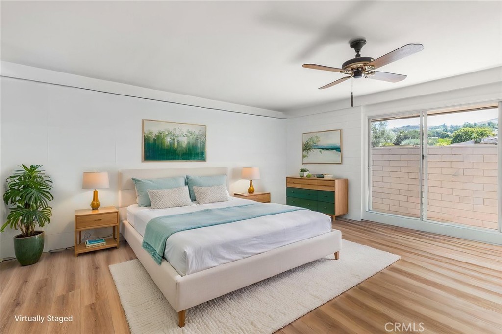Virtually staged primary bedroom without cabinet - 27121 Calle Caballero B, San Juan Capistrano CA 92675 - photo 10
