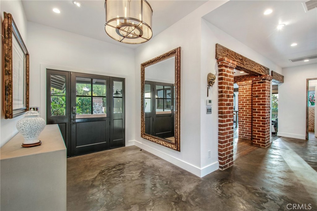 Entry to the home with polished concrete flooring in hallways - 27151 Mission Hills Drive, San Juan Capistrano CA 92675 - photo 4