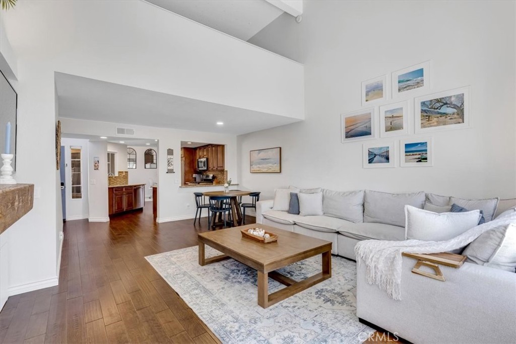 The kitchen opens into the dining & living rooms. - 27355 Paseo Laguna, San Juan Capistrano CA 92675 - photo 6