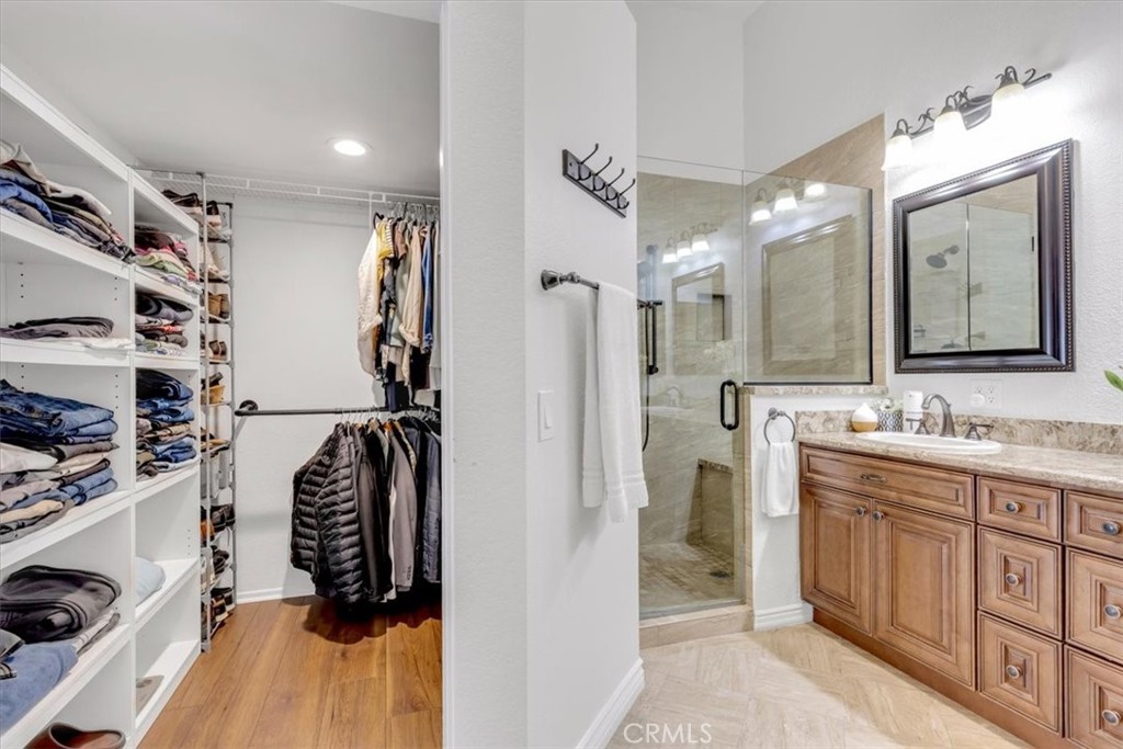 Primary's walk-in closet - 27355 Paseo Laguna, San Juan Capistrano CA 92675 - photo 25
